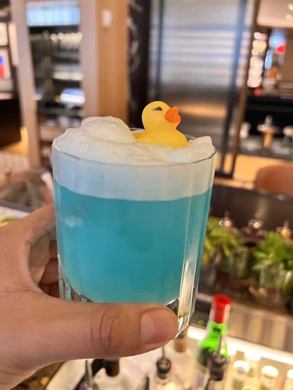 specialty blue cocktail with rubber ducky