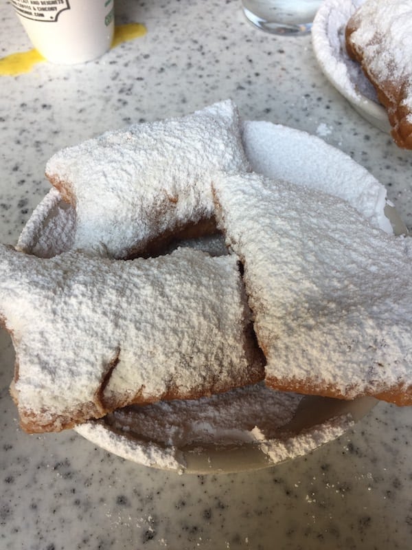 beignets covered in powdered sugar