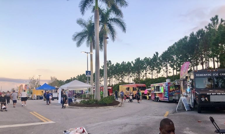 food trucks lined up in a parking lot