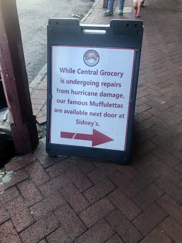Central Grocery Sign in the French Quarter sending you to Sidneys next door